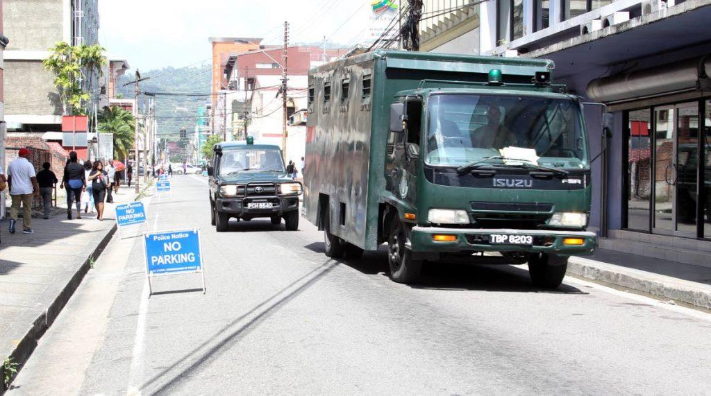 Security forces are on high alert around the PoS Magistrates' Court on St Vincent and Duke Street yesterday as Stephan Cummings, the main state witness, reappeared to testify in the Dana Seetahal murder preliminary inquiry. PHOTO BY ROGER JACOB